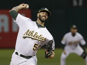 Oakland Athletics pitcher Mike Fiers throws to a New York Yankees batter during the first inning of a baseball game in Oakland, Calif., Wednesday, Sept. 5, 2018.