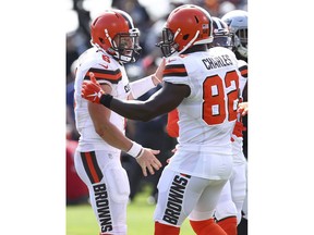 Cleveland Browns quarterback Baker Mayfield, left, celebrates with tight end Orson Charles (82) after Mayfield threw a touchdown pass to Darren Fells against the Oakland Raiders during the first half of an NFL football game in Oakland, Calif., Sunday, Sept. 30, 2018.