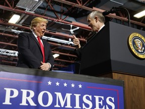 FILE - In this July 5, 2018, file photo, President Donald Trump looks to GOP Senate candidate Matt Rosendale, giving him the thumbs-up during a rally at the Four Seasons Arena at Montana ExpoPark, in Great Falls, Mont. Montana State Auditor Rosendale has made his support for Trump a centerpiece of his campaign to unseat U.S. Sen. Jon Tester.