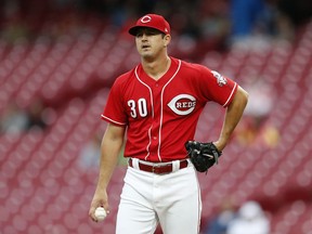 Cincinnati Reds starting pitcher Tyler Mahle (30) reacts after giving up a two-run home run to San Diego Padres' Austin Hedges during the third inning of a baseball game, Sunday, Sept. 9, 2018, in Cincinnati.