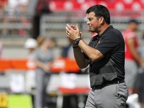 Ohio State acting head coach Ryan Day watches warm-ups before the start of their NCAA college football game against Oregon State Saturday, Sept. 1, 2018, in Columbus, Ohio.