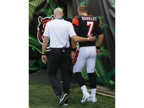 Cincinnati Bengals quarterback Matt Barkley (7) is helped off the field after an injury during the first half of the team's NFL preseason football game against the Indianapolis Colts, Thursday, Aug. 30, 2018, in Cincinnati.