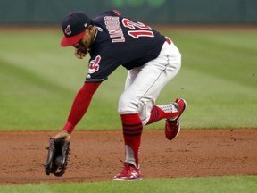 Cleveland Indians' Francisco Lindor fields a ball hit by Chicago White Sox's Omar Narvaez during the first inning of a baseball game, Thursday, Sept. 20, 2018, in Cleveland. Narvaez was out at first.