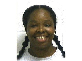 FILE - In this file photo provided by the Oklahoma Department of Corrections, Tondalao R. Hall is pictured in a photo dated July 7, 2009. A criminal justice group that's working to reduce Oklahoma's prison population says Hall's 30-year prison sentence for failing to report the abuse of her children by a boyfriend who served only two years for the abuse illustrates a wider problem. (Oklahoma Department of Corrections via AP, File)