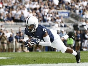 Penn State's DeAndre Thompkins (3) catches a touchdown pass against Kent State during the first half of an NCAA college football game in State College, Pa., Saturday, Sept. 15, 2018.