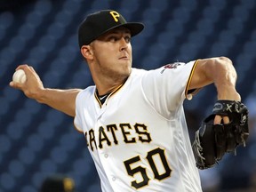 Pittsburgh Pirates starting pitcher Jameson Taillon delivers in the first inning of the team's baseball game against the Kansas City Royals in Pittsburgh, Tuesday, Sept. 18, 2018.