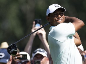 Tiger Woods hits from the 10th tee during the first round of the BMW Championship golf tournament at Aronimink Golf Club, Thursday, Sept. 6, 2018, in Newtown Square, Pa.