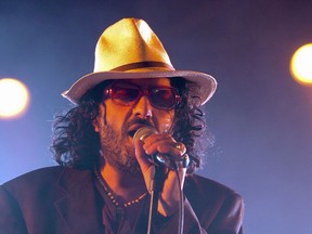 FILE - In this July 19, 2005 file photo, Algerian singer Rachid Taha sings on the main stage during the opening day of the Paleo Festival in Nyon, Switzerland. Rachid Taha, an Algerian singer who thrillingly blended Arabic music with rock and techno and at times wore blue contact lenses to protest anti-Arab prejudice in France, where he made his home, has died. He was 59.