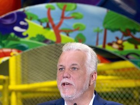 Liberal Leader Philippe Couillard responds to reporters' questions during a campaign stop at a community centre in Sherbrooke, Que., on Tuesday, Sept. 25, 2018.