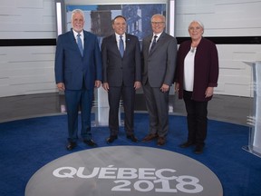 Liberal Leader Philippe Couillard, Coalition Avenir Quebec Leader Francois Legault, PQ Leader Jean-Francois Lisee and Quebec Solidaire Leader Manon Masse, left to right, stans on the television set for a photo prior to Face a Face Quebec 2018, the third Quebec elections leaders debate in Montreal, on Thursday, September 20, 2018.