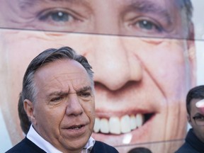 Coalition Avenir Quebec Leader Francois Legault responds to questions from reporters during a campaign stop in Sainte-Anne-des Plaines, Que. on Saturday, September 22, 2018.