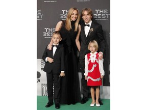 Croatia's soccer star Luka Modric, nominee for the Best FIFA Men's Player award, and his wife Vanja Bosnic, his son Ivano and his daughter Ema, arrive for the ceremony of the Best FIFA Football Awards in the Royal Festival Hall in London, Britain, Monday, Sept. 24, 2018.