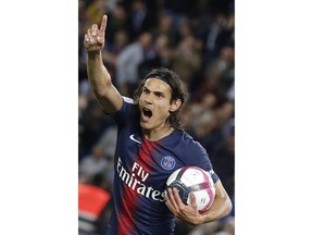 PSG's Edinson Cavani protest for a disallowed goal during their French League One soccer match between Paris-Saint-Germain and Saint-Etienne at the Parc des Princes stadium in Paris, Friday, Sept. 14, 2018.