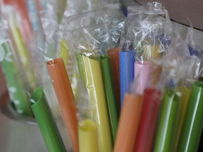 FILE - This July 17, 2018 file photo shows wrapped plastic straws at a bubble tea cafe in San Francisco. A law signed Thursday, Sept. 20, 2018, by Gov. Jerry Brown makes California the first state to bar full-service restaurants from automatically giving out single-use plastic straws. It takes effect next year.