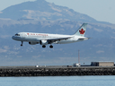 An Air Canada plane prepares to land on a runway at San Francisco International Airport in San Francisco.