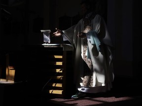 Roman Catholic priest Michal Lajcha serves a mass in a church in Klak, Slovakia, Monday, Sept. 17, 2018. Lajcha is challenging the Roman Catholic Church's celibacy rules in a rare instance of dissent in the conservative religious stronghold in central and eastern Europe.