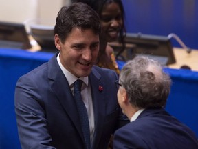 Canadian Prime Minister Justin Trudeau shakes hands with Bill Gates following a high level meeting on Financing the 2030 Agenda at the United Nations Monday Sept. 24, 2018.