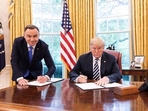 Polish President Andrzej Duda and U.S. President Donald Trump sign a strategic partnership pact at the White House on Sept. 18, 2018.