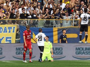 Parma's Roberto Inglese, top right, celebrates after scoring during the Serie A soccer match between Parma and Cagliari at the Ennoi Tardini Stadium in Parma, Italy, Saturday, Sept. 22, 2018.