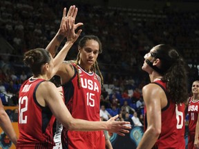 Brittney Griner of the United States celebrates with teammates during the Women's basketball World Cup semi final match between Belgium and the U.S.A. in Tenerife, Spain, Saturday Sept. 29, 2018.