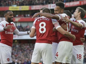 Arsenal's Pierre-Emerick Aubameyang, centre right, celebrates with team mates after scoring his side's 2nd goal during an English Premier League soccer match between Arsenal and Everton at the Emirates Stadium in London, Sunday Sept. 23, 2018.