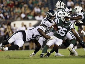 New York Jets' Charcandrick West (35) is tackled by Philadelphia Eagles' Jordan Hicks (58) during the first half of a preseason NFL football game Thursday, Aug. 30, 2018, in Philadelphia.