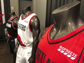 CORRECTS DATE TO SEPT. 18 - The Portland Trail Blazers display new NBA basketball jerseys at the team's practice facility in Tualatin, Ore., Tuesday, Sept. 18, 2018. The Trail Blazers announced, Wednesday, Sept. 19,  a multi-year jersey sponsorship deal with Performance Health, an Illinois-based company that sells the topical pain reliever Biofreeze.