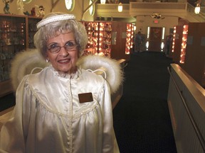 In this Sept. 13, 2018, photo, Joyce Berg stands in The Angel Museum in Beloit, Wis. The museum's final day will be Saturday, Sept. 29, 2018. Berg and her late husband hold a Guinness World Record, with more than 13,000 angels. Berg, one of the museum's founders, said they are closing after 20 years due to insufficient funds, membership, sponsors and volunteers.
