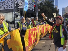 Members of the group 1000 Grandmothers protest outside the Moscone Center in San Francisco where the Global Climate Action Summit is being held, on Thursday, Sept. 13, 2018. The group, which says it is made up of elder women activists working to address the climate crisis, chanted "Listen to your Grandma, no more fracking!"