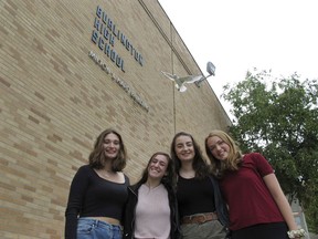 In this Sept. 20, 2018 photo, Student Newspaper Censorship Register editors, from left, Nataleigh Noble, Halle Newman, Julia Shannon-Grillo and Jenna Peterson stand outside the Burlington High School in Burlington, Vt. The students stood up to censorship in their student newspaper and won.