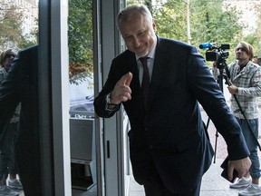 Russian National Anti-doping Agency RUSADA head Yuri Ganus waves after speaking to the media in Moscow, Russia, Thursday, Sept. 20, 2018.