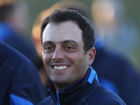 Europe's Francesco Molinari smiles as he prepares for the European Ryder Cup team photo at Le Golf National in Guyancourt, outside Paris, France, Tuesday, Sept. 25, 2018. The 42nd Ryder Cup will be held in France from Sept. 28-30, 2018 at Le Golf National.