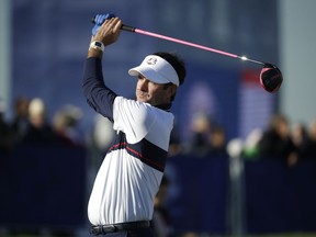 Bubba Watson of the US plays a shot on the driving range before a practice round at Le Golf National in Guyancourt, outside Paris, France, Tuesday, Sept. 25, 2018. The 42nd Ryder Cup will be held in France from Sept. 28-30, 2018 at Le Golf National.