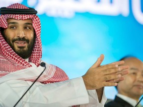 FILE - In this Tuesday, Oct. 24, 2017, file photo released by the state-run Saudi Press Agency, Saudi Crown Prince Mohammed bin Salman speaks at the opening ceremony of Future Investment Initiative Conference in Riyadh, Saudi Arabia. Saudi Arabia's sovereign wealth fund invested over $1 billion on Monday, Sept. 17, 2018, in an American electric car manufacturer just weeks after Tesla CEO Elon Musk earlier claimed the kingdom would help his own firm go private.