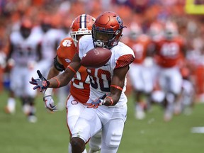 Syracuse's Taj Harris juggles a pass for a reception during the first half of an NCAA college football game against Clemson Saturday, Sept. 29, 2018, in Clemson, S.C.