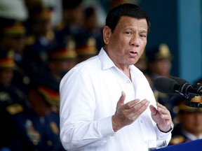 FILE - In this Aug. 8, 2018, file photo, Philippines president Rodrigo Duterte gestures while addressing police force to mark the 117th Philippine National Police Service anniversary at Camp Crame in Quezon city northeast of Manila. The first-ever visit to Israel of a leader of the Philippines is sure to be touted by Prime Minister Benjamin Netanyahu as another stirring success in his campaign to reverse years of isolation and enhance Israel's relations with various countries across the globe.