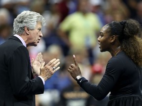 Serena Williams talks with referee Brian Earley during the women's final of the U.S. Open tennis tournament against Naomi Osaka, of Japan, Saturday, Sept. 8, 2018, in New York.