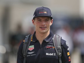 Red Bull Racing driver Max Verstappen of Netherlands arrives at the Marina Bay City Circuit ahead of the Singapore Formula One Grand Prix in Singapore, Friday, Sept. 14, 2018.