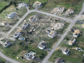 Damage from a tornado is seen in Dunrobin, Ont., west of Ottawa on Saturday, Sept. 22, 2018. The storm tore roofs off of homes, overturned cars and felled power lines in the Ottawa community of Dunrobin and in Gatineau, Que.