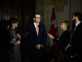 Treasury Board President Scott Brison speaks in the foyer of the House of Commons on Parliament Hill in Ottawa on Wednesday, Sept. 19, 2018.