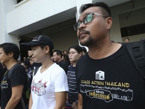 Plaintiffs of Ford cars with bad transmissions gather outside a civil court before a verdict in a class-action lawsuit in Bangkok, Thailand, Friday, Sept. 21, 2018. The Thai court has ordered Ford Motor Co. to pay 291 customers a total of around $720,000 in compensation for selling cars equipped with faulty transmissions.