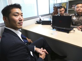 The leader of the political party named Future Forward Party, Thanathorn Juangroongruangkit arrives at the Technology Crime Suppression Division to hear police charges in Bangkok, Thailand, Monday, Sept. 17, 2018. Thanathorn and two other senior party members were charged by police in August for allegedly violating a section of the law that makes it a crime to send false information or information that damages the country's stability carrying a maximum five-year prison sentence. Police had acted on a complaint filed by the ruling junta.