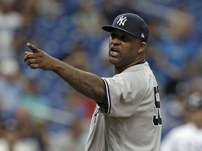 New York Yankees' CC Sabathia points at the Tampa Bay Rays dugout after he was ejected for hitting Tampa Bay Rays' Jesus Sucre with a pitch during the sixth inning of a baseball game Thursday, Sept. 27, 2018, in St. Petersburg, Fla.