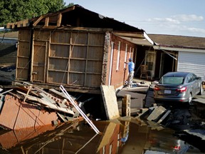 Part of the Starlite Motel is washed away in the aftermath of flooding from Hurricane Florence in Spring Lake, N.C., Wednesday, Sept. 19, 2018. Kishor Depani, one of the brothers who co-owned the motel said the family had invested their life-savings into the establishment.