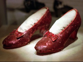 FILE - This April 10, 1996, file photo shows one of the four pairs of ruby slippers worn by Judy Garland in the 1939 film "The Wizard of Oz" on display during a media tour of the "America's Smithsonian" traveling exhibition in Kansas City, Mo. Federal authorities say they have recovered a pair of ruby slippers worn by Garland that were stolen from the Judy Garland Museum in Grand Rapids, Minn., in August 2005 when someone went through a window and broke into the small display case. The shoes were insured for $1 million.