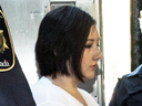 Terri-Lynne McClintic, convicted in the death of eight-year-old Tori Stafford, is escorted into court on Sept. 12, 2012 for her trial in an assault on another inmate.