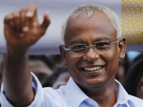 FILE - In this Sept. 24, 2018, file photo, Ibrahim Mohamed Solih, the president-elect of the Maldives interacts with his supporters during a gathering in Male, Maldives. The Maldives' election commission on Saturday, Sept. 29, 2018 released the final results of this month's presidential election, confirming the surprising opposition victory by longtime lawmaker Ibrahim Mohamed Solih.