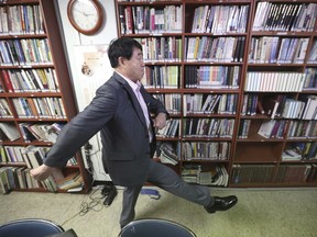 In this Aug. 29, 2018 photo, North Korean defector Sim Ju-il shows how to do North Korean military goosesteps during an interview in Seoul, South Korea. Even two decades after he fled North Korea, even with an abiding hatred of the ruling dictatorship, Sim sometimes still relives the days when he goose-stepped past the nation's revered founder, Kim Il Sung, as a young man. Goose-stepping soldiers are the most spectacular part of North Korea's massive military parades.