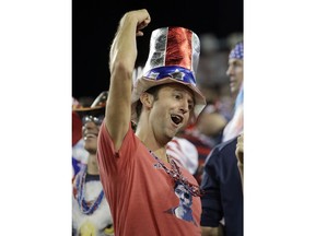 A fan of the U.S. men's national soccer team team cheers during an international friendly match against Mexico, Tuesday, Sept. 11, 2018, in Nashville, Tenn.