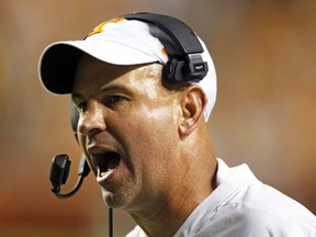 Tennessee head coach Jeremy Pruitt yells at an official in the second half of an NCAA college football game against Florida, Saturday, Sept. 22, 2018, in Knoxville, Tenn.